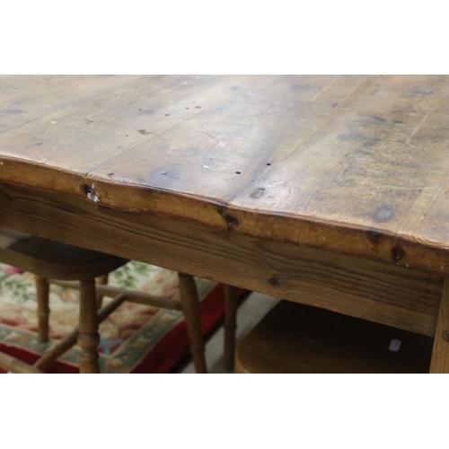 609 - Large Pine Kitchen Table raised on turned legs, 183cm long x 95cm wide x 77cm wide together with a s... 