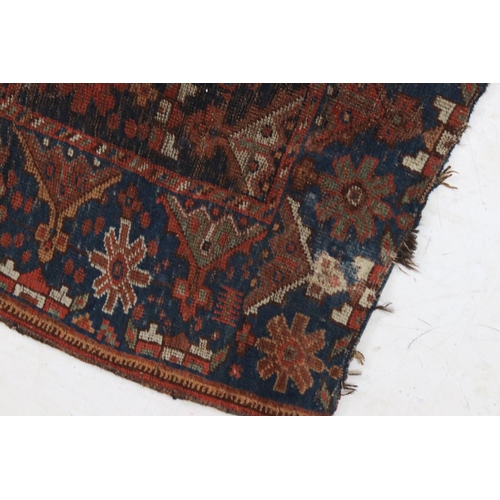 613 - Antique Eastern Wool Red and Blue Ground Rug, 130cm x 100cm