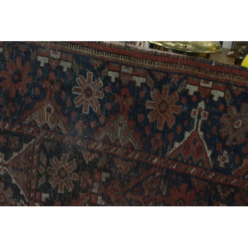 613 - Antique Eastern Wool Red and Blue Ground Rug, 130cm x 100cm