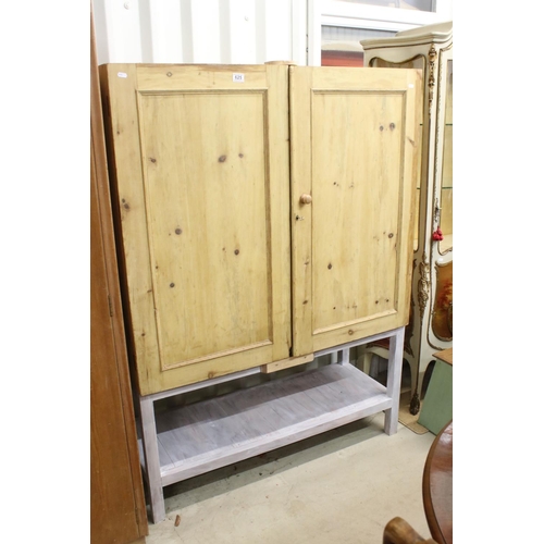 625 - Pine Linen Cupboard. the two doors opening to shelf and three pull out slide, raised on a later pain... 