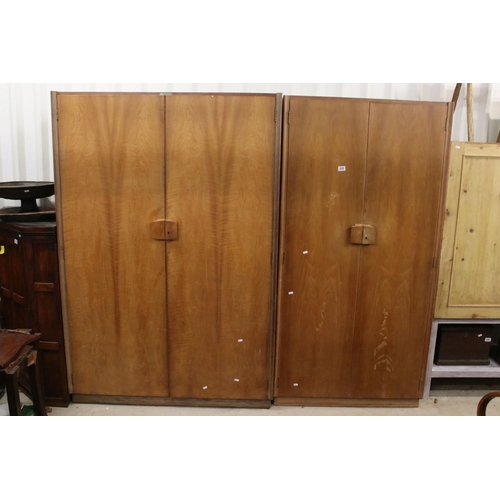 628 - Gordon Russell of Broadway, Pair of Mid century Walnut Wardrobes, both with double doors, one measur... 