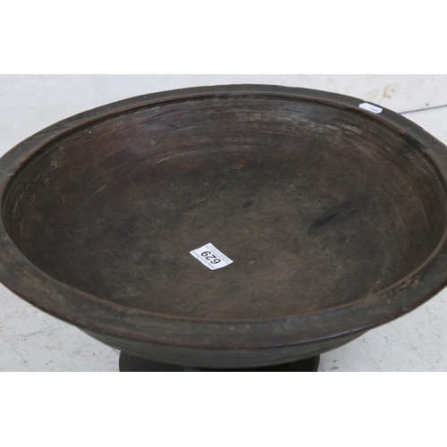 629 - Hand Turned Wooded Footed Bowl, 46cm diameter x 23cm high together with Wooden Dough Bowl, 60cm long