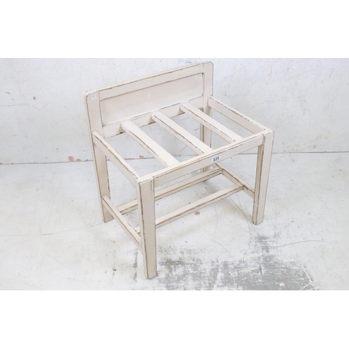 635 - Painted luggage stand, 57cm wide x 61cm high