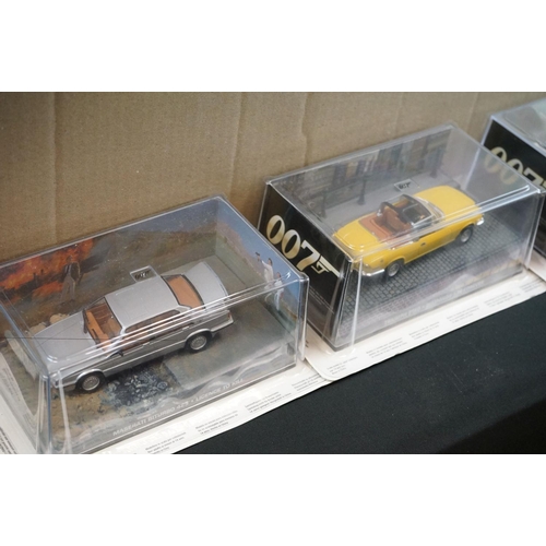 1166 - 25 Carded The James Bond Car Collection diecast models to include Maserati Biturbo 425, Jaguar XKR, ... 