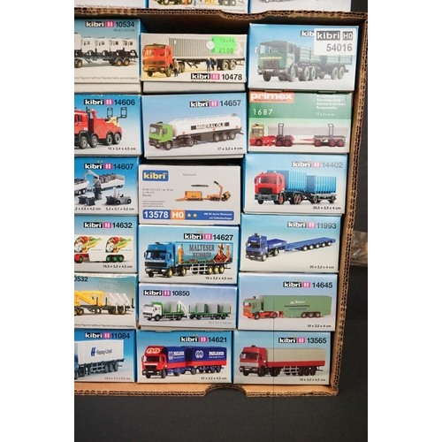 243 - Collection of around 70 boxed Kibri HO gauge plastic model kits, all various lorries & commercia veh... 