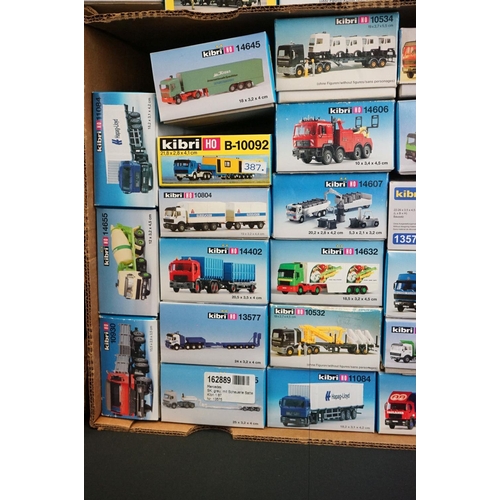 243 - Collection of around 70 boxed Kibri HO gauge plastic model kits, all various lorries & commercia veh... 