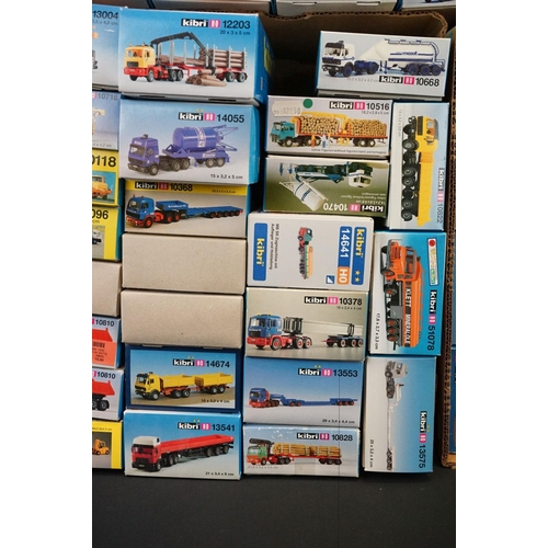 243 - Collection of around 70 boxed Kibri HO gauge plastic model kits, all various lorries & commercia veh... 