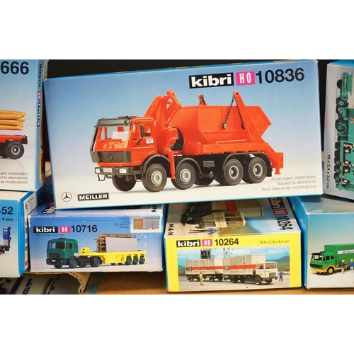 243 - Collection of around 70 boxed Kibri HO gauge plastic model kits, all various lorries & commercia veh... 