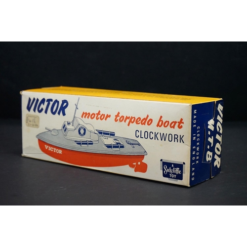 332 - Boxed Sutcliffe Clockwork Victor Motor Torpedo Boat tinplate model  in pale blue & white, complete w... 