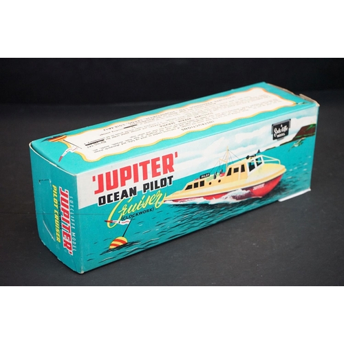 333 - Boxed Sutcliffe Model Clockwork Jupiter Ocean Pilot Cruiser tinplate model in red & white, complete ... 