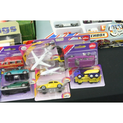 1283 - Around 80 boxed/carded diecast models & multi sets to include Siku, Matchbox Convoy, Chad Valley, Sc... 