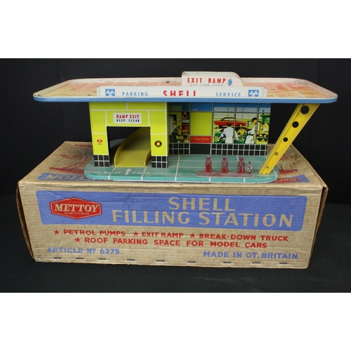 1292 - Boxed Mettoy tin plate Shell Filling Station 6275, some discolouring and wear, plus another mid 20th... 