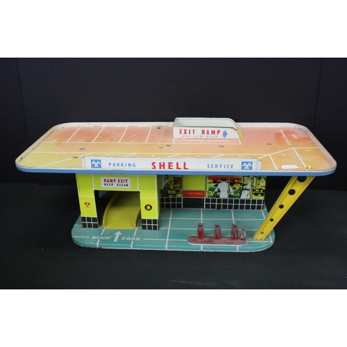 1292 - Boxed Mettoy tin plate Shell Filling Station 6275, some discolouring and wear, plus another mid 20th... 