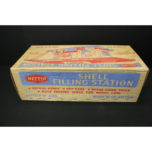 1292 - Boxed Mettoy tin plate Shell Filling Station 6275, some discolouring and wear, plus another mid 20th... 