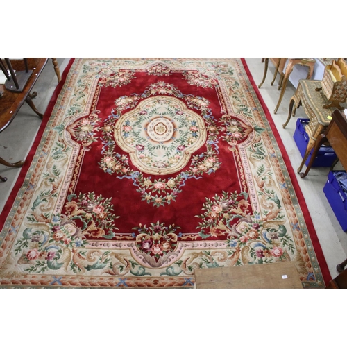 566 - Large Chinese Carpet, with floral pattern on a red and cream ground, 422cm x 307cm