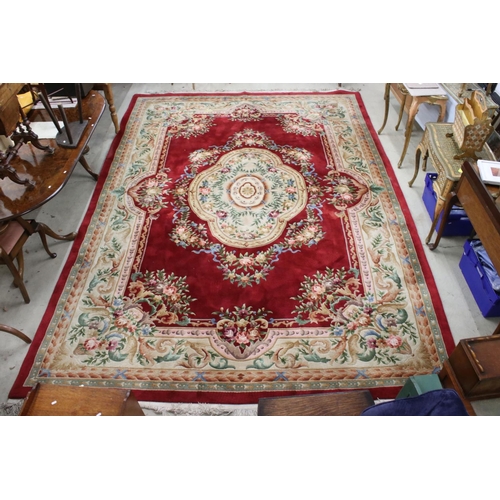 566 - Large Chinese Carpet, with floral pattern on a red and cream ground, 422cm x 307cm