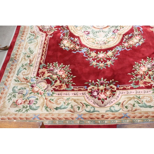 566 - Large Chinese Carpet, with floral pattern on a red and cream ground, 422cm x 307cm