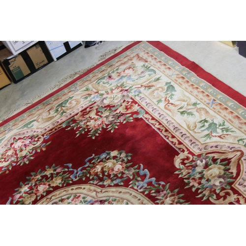 574 - Large Chinese Carpet, with floral pattern on a red and cream ground, 366cm x 277cm