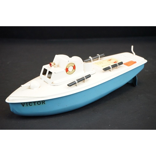 340 - Boxed Sutcliffe Clockwork Victor Motor Torpedo Boat tinplate model  in pale blue & blue, complete wi... 