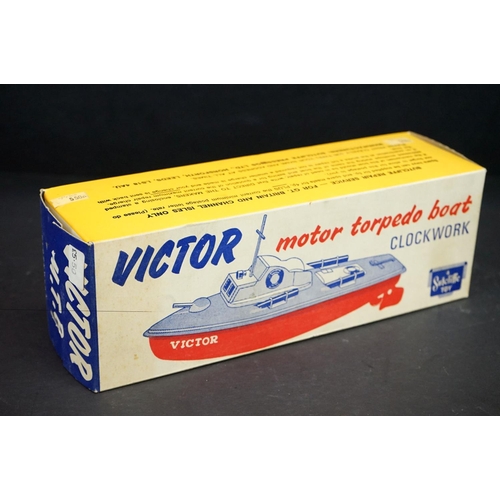 340 - Boxed Sutcliffe Clockwork Victor Motor Torpedo Boat tinplate model  in pale blue & blue, complete wi... 