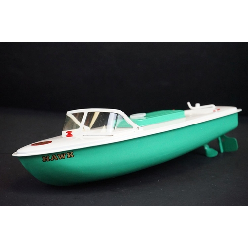 342 - Boxed Sutcliffe Model Hawk clockwork metal speed boat in light green & white, complete with flag & k... 