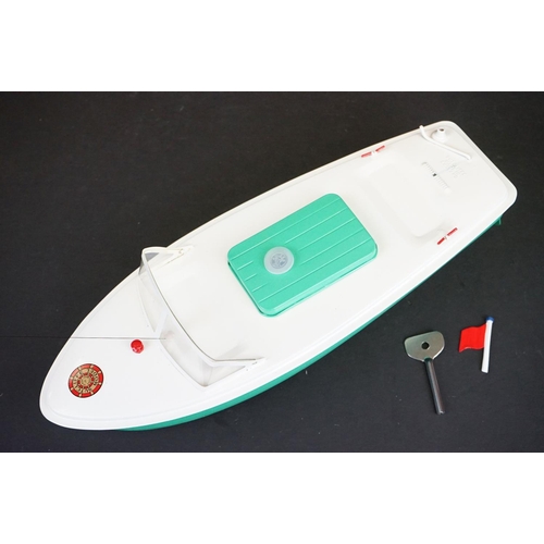 342 - Boxed Sutcliffe Model Hawk clockwork metal speed boat in light green & white, complete with flag & k... 