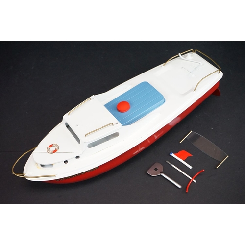 343 - Boxed Sutcliffe Model Commodore clockwork Cruiser metal model in red & white, complete with accessor... 