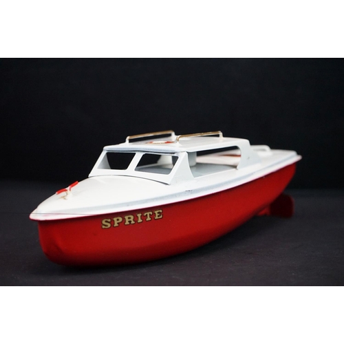 346 - Boxed Sutcliffe tinplate Sprite Day Cruiser clockwork model in red & white with key, a few rusty mar... 