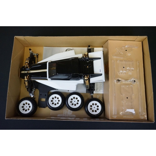 389 - Boxed Kyosho 1/10 R/C 4WD Off Road Racer Turbo Optima radio control car, with instructions