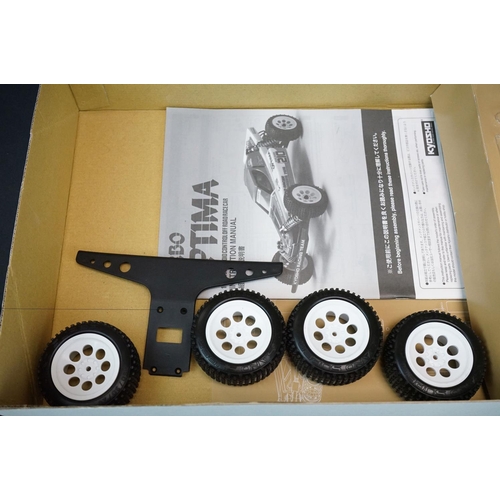 389 - Boxed Kyosho 1/10 R/C 4WD Off Road Racer Turbo Optima radio control car, with instructions