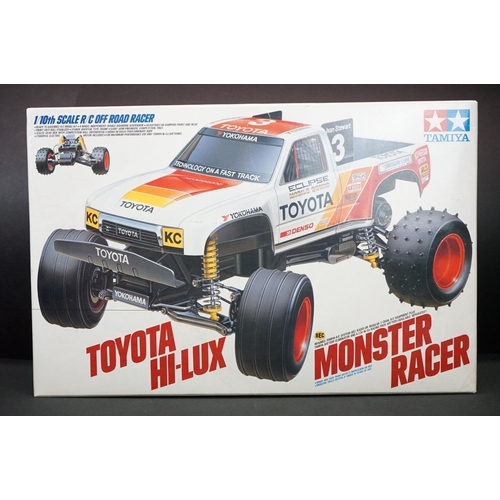 390 - Boxed Tamiya 1/10 58086 R/C Toyota Hi-Lux Monster Racer radio control car with instructions