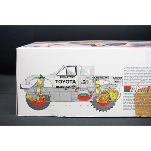 390 - Boxed Tamiya 1/10 58086 R/C Toyota Hi-Lux Monster Racer radio control car with instructions