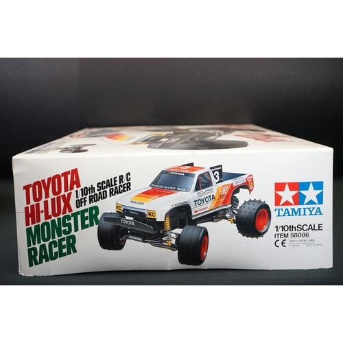 390 - Boxed Tamiya 1/10 58086 R/C Toyota Hi-Lux Monster Racer radio control car with instructions