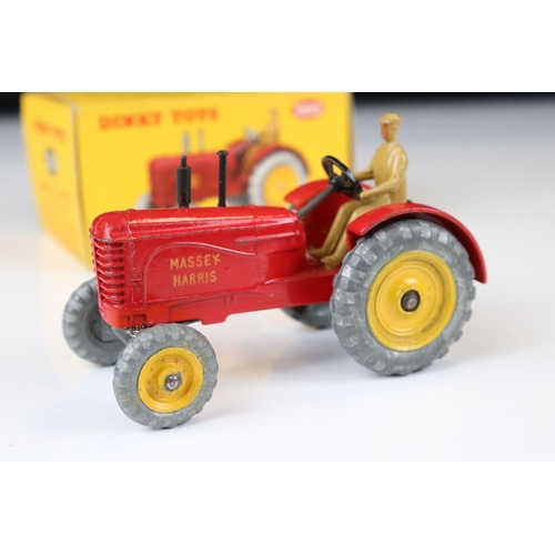 1330 - Boxed Dinky 300 Massey-Harris Tractor diecast model in red with driver, plus a boxed 322 Disc Harrow... 