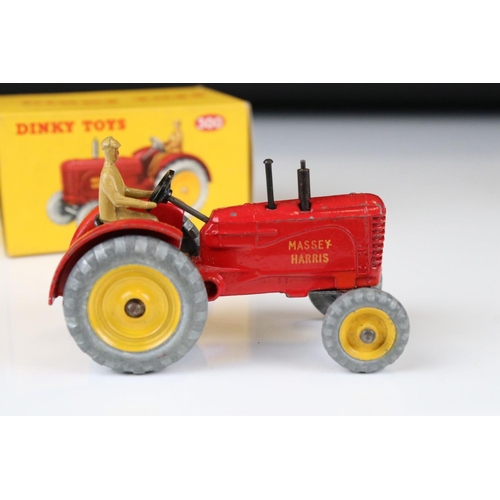 1330 - Boxed Dinky 300 Massey-Harris Tractor diecast model in red with driver, plus a boxed 322 Disc Harrow... 