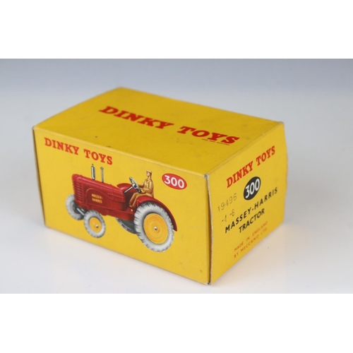 1330 - Boxed Dinky 300 Massey-Harris Tractor diecast model in red with driver, plus a boxed 322 Disc Harrow... 