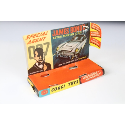 1355 - Boxed Corgi 261 James Bond 007 Aston Martin DB5 diecast model with ejector figure and secret instruc... 