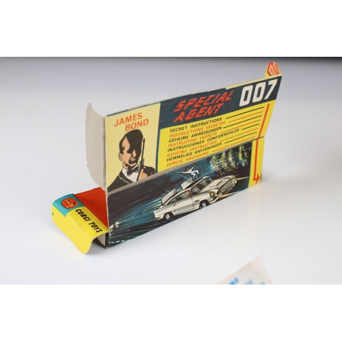 1355 - Boxed Corgi 261 James Bond 007 Aston Martin DB5 diecast model with ejector figure and secret instruc... 