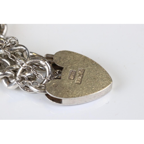 119 - Silver Curb Link Bracelet with silver hallmarked heart shaped lock, Birmingham 1960