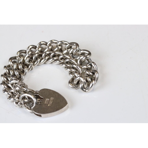 119 - Silver Curb Link Bracelet with silver hallmarked heart shaped lock, Birmingham 1960