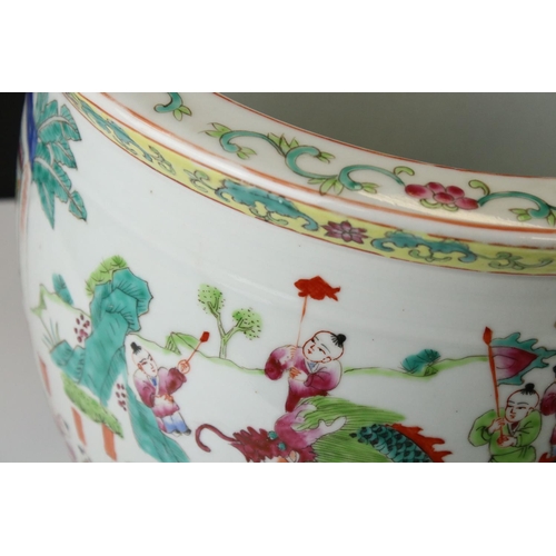 22 - Chinese Porcelain Famille Rose Jardiniere decorated with a procession of figures and musicians withi... 