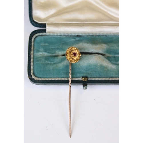 37 - Victorian 15ct Gold Stick Pin, the head inset with a Ruby, stamped 15ct, 6cm long, with case