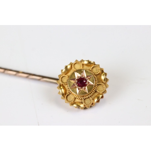 37 - Victorian 15ct Gold Stick Pin, the head inset with a Ruby, stamped 15ct, 6cm long, with case