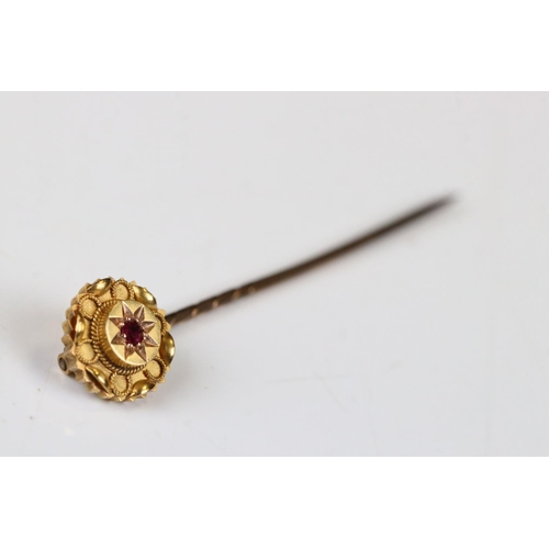 37 - Victorian 15ct Gold Stick Pin, the head inset with a Ruby, stamped 15ct, 6cm long, with case