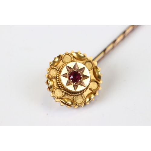 37 - Victorian 15ct Gold Stick Pin, the head inset with a Ruby, stamped 15ct, 6cm long, with case