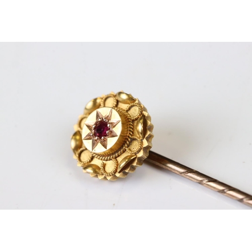 37 - Victorian 15ct Gold Stick Pin, the head inset with a Ruby, stamped 15ct, 6cm long, with case