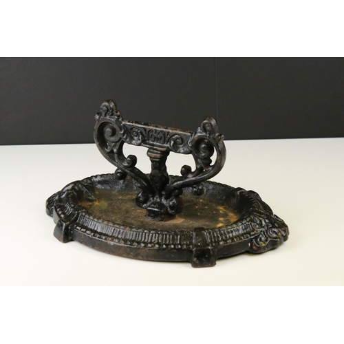 64 - Victorian Cast Iron Boot Scraper, decorative design on oval base, 36cm long x 18cm high