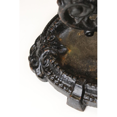 64 - Victorian Cast Iron Boot Scraper, decorative design on oval base, 36cm long x 18cm high