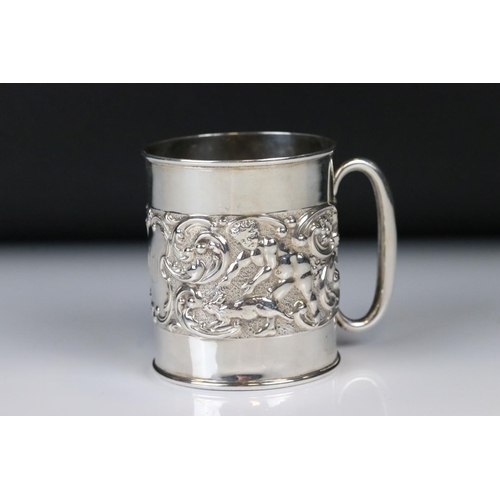 66 - Edwardian Silver Christening Tankard with a band of scrolled repousse decoration featuring cherubs w... 