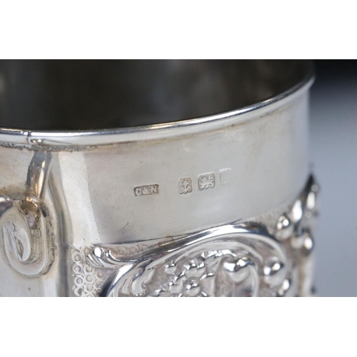 66 - Edwardian Silver Christening Tankard with a band of scrolled repousse decoration featuring cherubs w... 